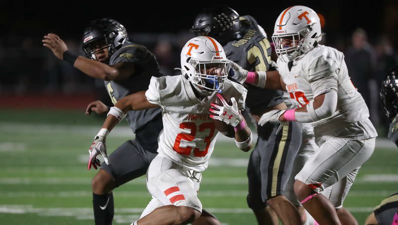 Timpview’s Aisa Galea’I runs with the ball during a varsity football game against Maple Mountain at Maple Mountain High School in Spanish Fork on Friday, Oct. 6, 2023. Timpview won 42-20.