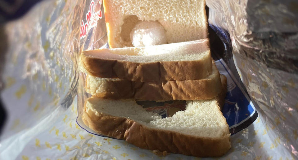 A ball of what's believed to be meth seen in a hollowed-out loaf of bread.