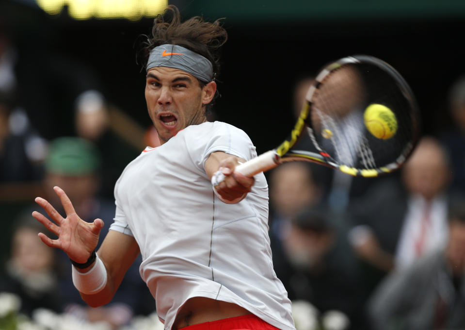 FILE - Spain's Rafael Nadal returns the ball to compatriot David Ferrer during the men's final match of the French Open tennis tournament at the Roland Garros stadium Sunday, June 9, 2013, in Paris. (AP Photo/Petr David Josek, FIle)