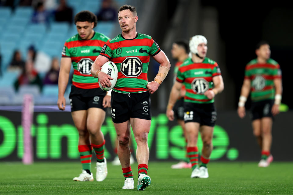 Damien Cook reacts after a try.