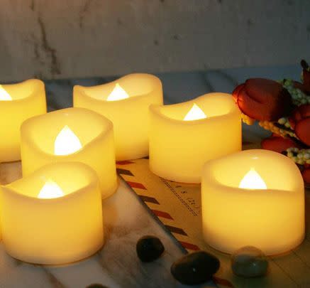 Lay these flickering LED tea lights around to add to the romantic ambience