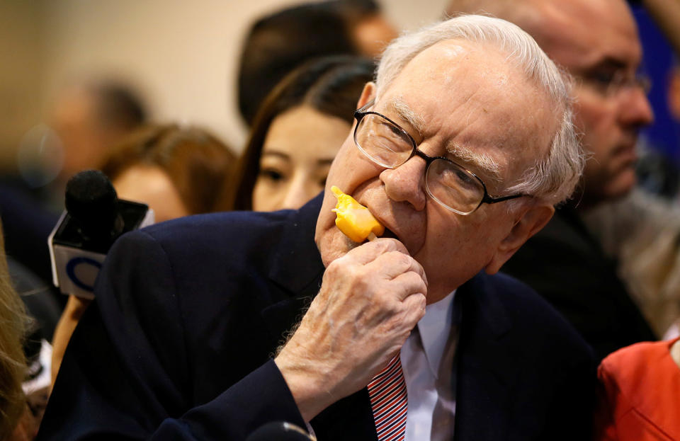 <p>Berkshire Hathaway chairman and CEO Warren Buffett enjoys an ice cream treat from Dairy Queen before the Berkshire Hathaway annual meeting in Omaha, Nebraska, May 6, 2017. (Photo: Rick Wilking/Reuters) </p>