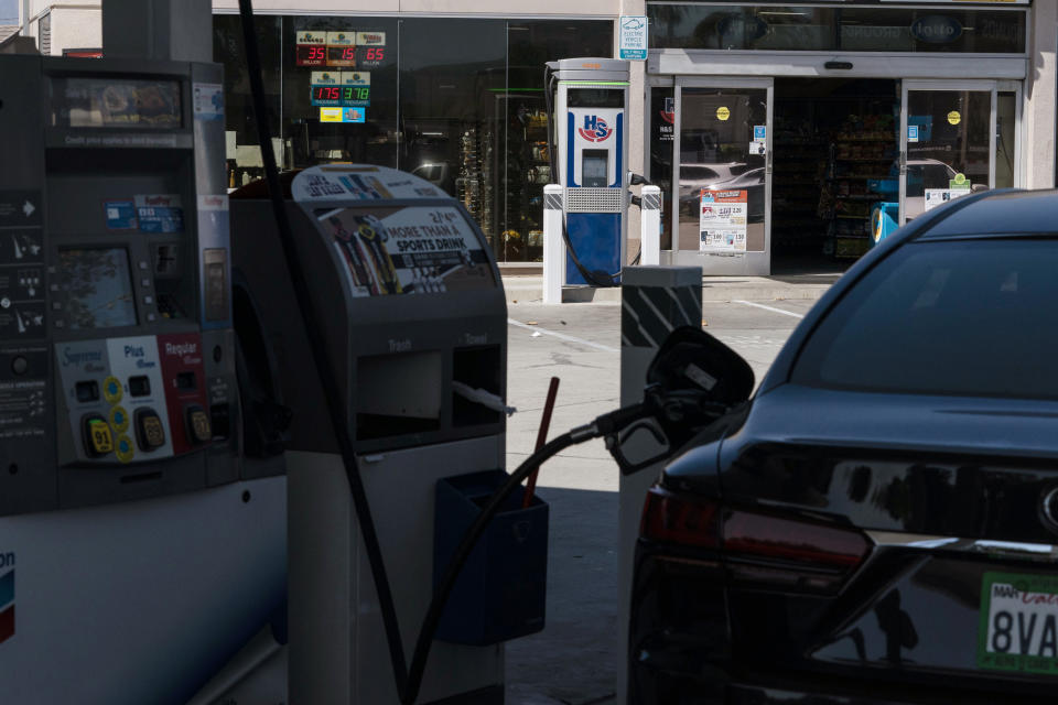 An electric vehicle charger stands in the parking lot of a gas station in South El Monte, Calif., Friday, Aug. 26, 2022. Discounted prices, car-share programs, and a robust network of public charging stations are among the ways California will try to make electric vehicles affordable and convenient for people of all income levels as it phases out the sale of new gas cars by 2035. Advocates for the policy say the switch from gas- to battery-powered cars is a necessary step to reducing pollution in disadvantaged neighborhoods, but that the state make sure those residents can access the cars, too.(AP Photo/Jae C. Hong)