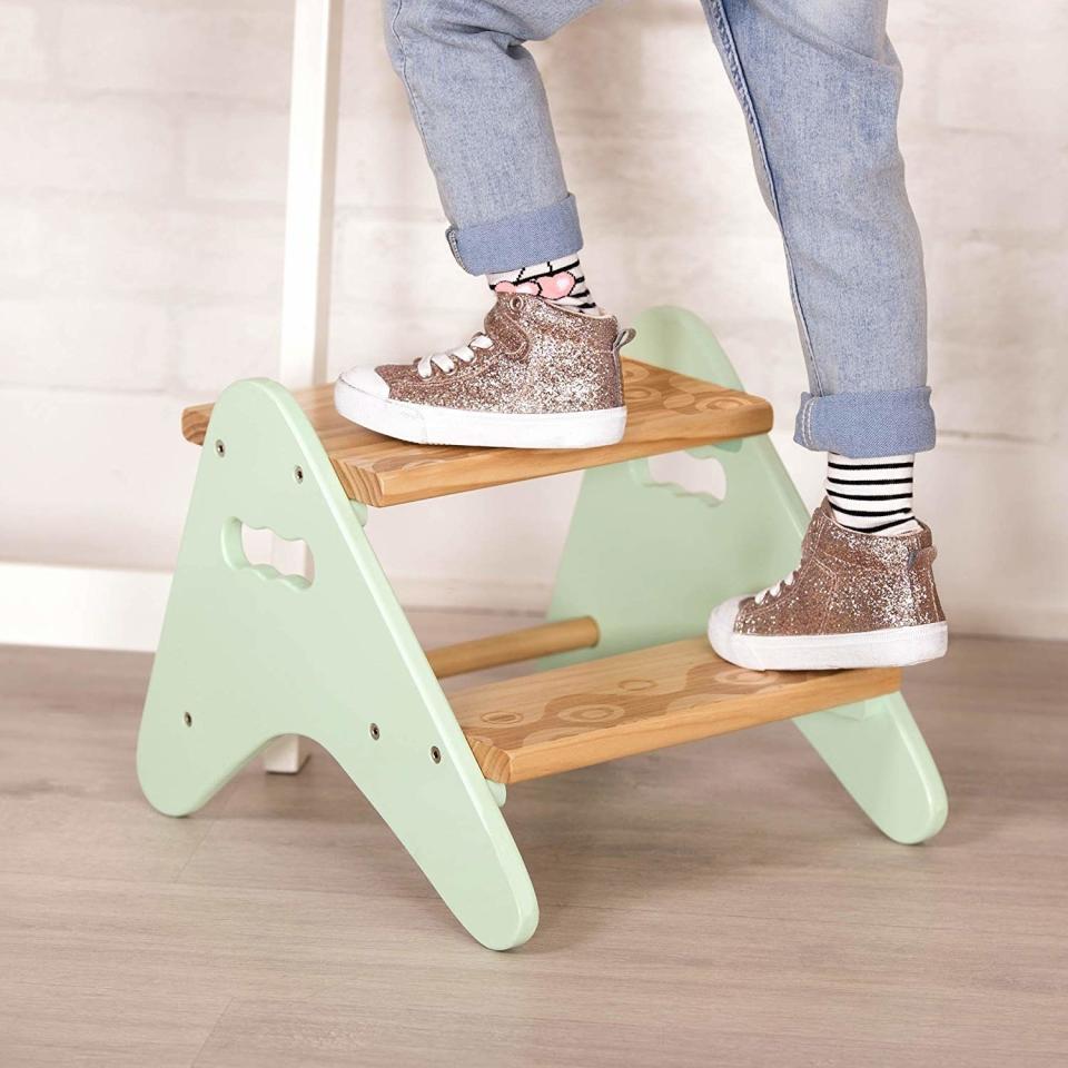 This will give your kid a ~lift~ while also raising your decor up a couple of notches because it won't clash with the rest of your home. <br /><br /><strong>Promising review:</strong> "<strong>This is very cute and very easy to assemble.</strong> It arrived when expected and in new condition. It's the perfect height for my 2-year-old to reach the faucet. It's a little heavy for her to pick up but she can push it around just fine." &mdash; <a href="https://www.amazon.com/gp/customer-reviews/RH7L82KFH936A?&amp;linkCode=ll2&amp;tag=huffpost-bfsyndication-20&amp;linkId=cf34605c2416327342fb79c6d013d86c&amp;language=en_US&amp;ref_=as_li_ss_tl" target="_blank" rel="nofollow noopener noreferrer" data-skimlinks-tracking="5854435" data-vars-affiliate="Amazon" data-vars-href="https://www.amazon.com/gp/customer-reviews/RH7L82KFH936A?tag=bfmal-20&amp;ascsubtag=5854435%2C26%2C37%2Cmobile_web%2C0%2C0%2C16324255" data-vars-keywords="cleaning,fast fashion" data-vars-link-id="16324255" data-vars-price="" data-vars-product-id="20942643" data-vars-product-img="" data-vars-product-title="" data-vars-retailers="Amazon">Liz<br /><br /></a><strong>Get it from Amazon for <a href="https://www.amazon.com/B-spaces-Battat-boost-Toddler/dp/B072R7138Z?&amp;linkCode=ll1&amp;tag=huffpost-bfsyndication-20&amp;linkId=ea3e7124eea01a9330f77d66494d5f4c&amp;language=en_US&amp;ref_=as_li_ss_tl" target="_blank" rel="nofollow noopener noreferrer" data-skimlinks-tracking="5854435" data-vars-affiliate="Amazon" data-vars-asin="B072R7138Z" data-vars-href="https://www.amazon.com/dp/B072R7138Z?tag=bfmal-20&amp;ascsubtag=5854435%2C26%2C37%2Cmobile_web%2C0%2C0%2C16323402" data-vars-keywords="cleaning,fast fashion" data-vars-link-id="16323402" data-vars-price="" data-vars-product-id="18412388" data-vars-product-img="https://m.media-amazon.com/images/I/41C+V-SSOQL.jpg" data-vars-product-title="B. spaces by Battat &ndash; Kids Wooden Two Step Stool &ndash; Peek-A-Boost &ndash; Mint &amp; Wood" data-vars-retailers="Amazon">$26.95</a>.</strong>