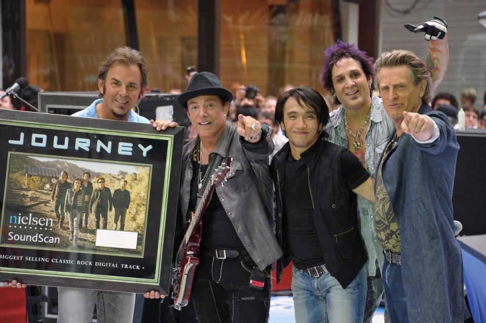 Journey’s current formation including keyboard player Jonathan Cain, guitar player Neal Schon, singer Arnel Pineda, drummer Deen Castronovo and bass player Ross Valor (Getty Images)