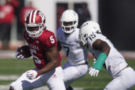 Indiana's Stephen Carr (5) is tackled by Michigan State's Angelo Grose (15) during the first half of an NCAA college football game, Saturday, Oct. 16, 2021, in Bloomington, Ind. (AP Photo/Darron Cummings)
