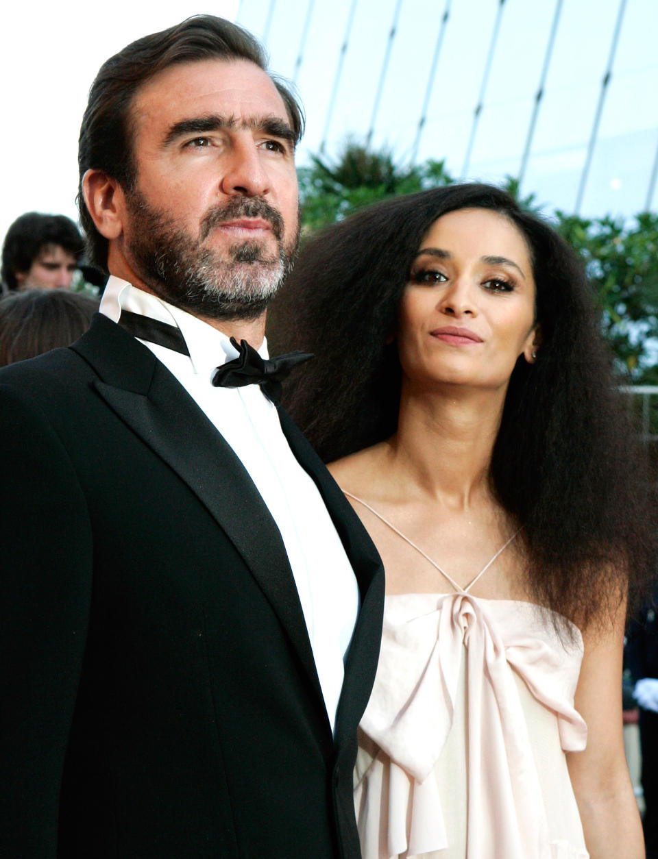 French actor and former soccer player Eric Cantona, left, and his wife, French actress Rachida Brakni, right, arrive on the red carpet for the screening of 'Looking for Eric', during the 62nd International film festival in Cannes, southern France, Monday, May 18, 2009.(AP Photo/Francois Mori)