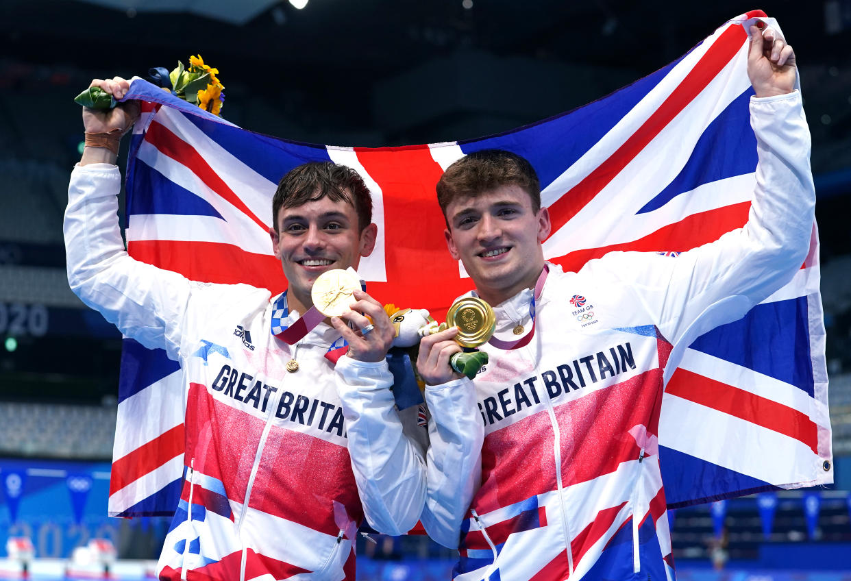 Great Britain's Tom Daley (left) and Matty Lee celebrate winning gold in the Men's Synchronised 10m Platform Final at the Tokyo Aquatics Centre on the third day of the Tokyo 2020 Olympic Games in Japan. Picture date: Monday July 26, 2021.