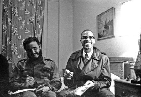 Fidel Castro shares a laugh with Malcolm X at the Hotel Theresa in New York, October 19, 1960. REUTERS/Prensa Latina