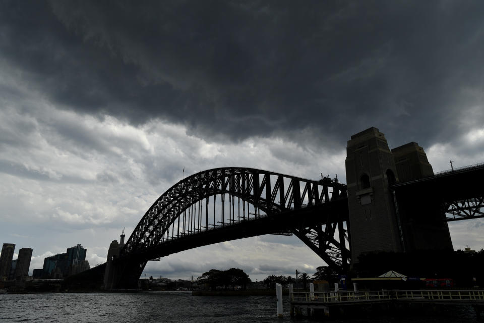 Storm clouds seen over the Sydney Harbour Bridge in Sydney, Monday.