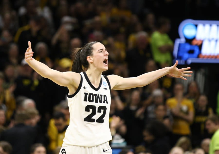 IOWA CITY, IOWA- MARCH 25: Guard Caitlin Clark #22 of the Iowa Hawkeyes celebrates after drawing a foul late in the second half against the West Virginia Mountaineers during their second round match-up in the 2024 NCAA Division 1 Women’s Basketball Championship at Carver-Hawkeye Arena on March 25, 2024 in Iowa City, Iowa. (Photo by Matthew Holst/Getty Images)