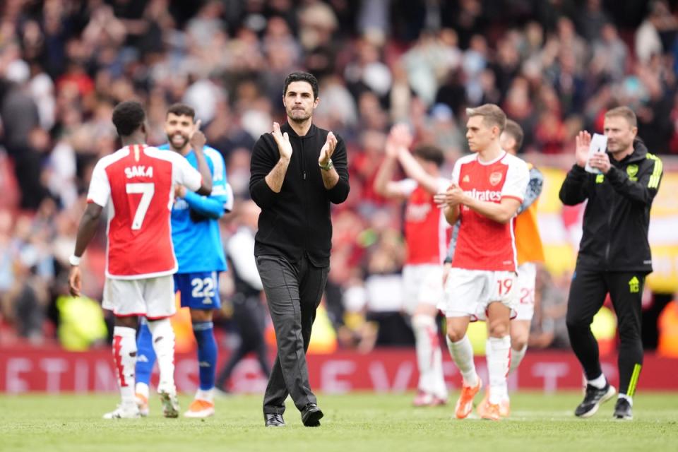 Mikel Arteta's Arsenal are just two points behind City as the final day of competition approaches (PA)