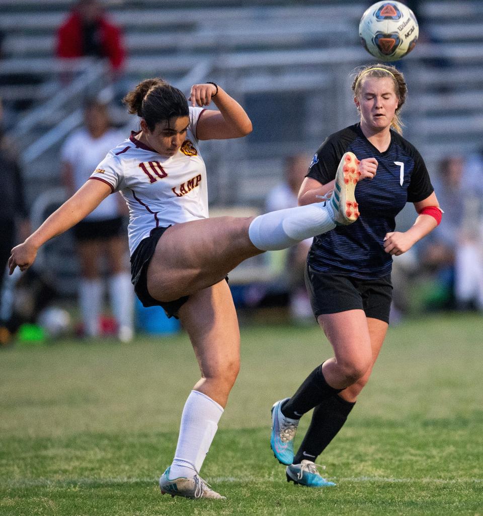 LAMP’s Susie McGreachy(10) and Montgomery Catholic's Heather Walski (7) during their game on the Catholic campus in Montgomery, Ala., on Tuesday April 9, 2024.