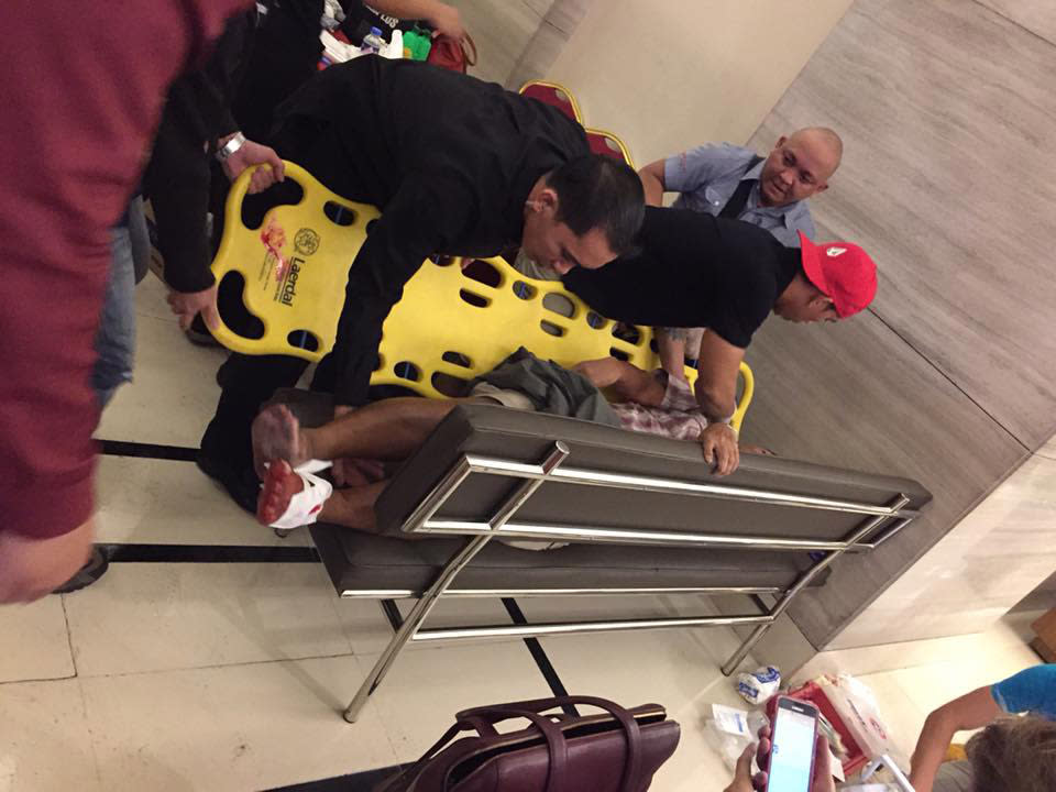 <p>First responders assist a victim of the Resorts World Manila attack in Manila, Philippines on June 1, 2016. (Tikos Low via Facebook) </p>