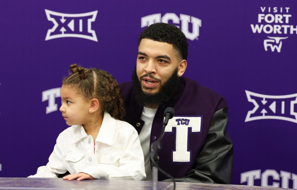 Thunder forward Kenrich Williams sits with his daughter and speaks to the media before his jersey was officially retired by TCU on Saturday  at Ed and Rae Schollmaier Arena in Fort Worth, Texas.