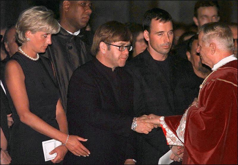 Princess Diana with Elton John at the requiem mass for Gianni Versace in Milan, 1997. 