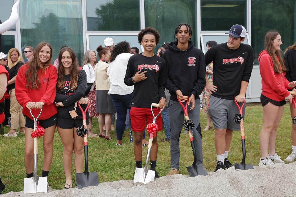 Current Rogers High students take part in the groundbreaking ceremony on Friday.