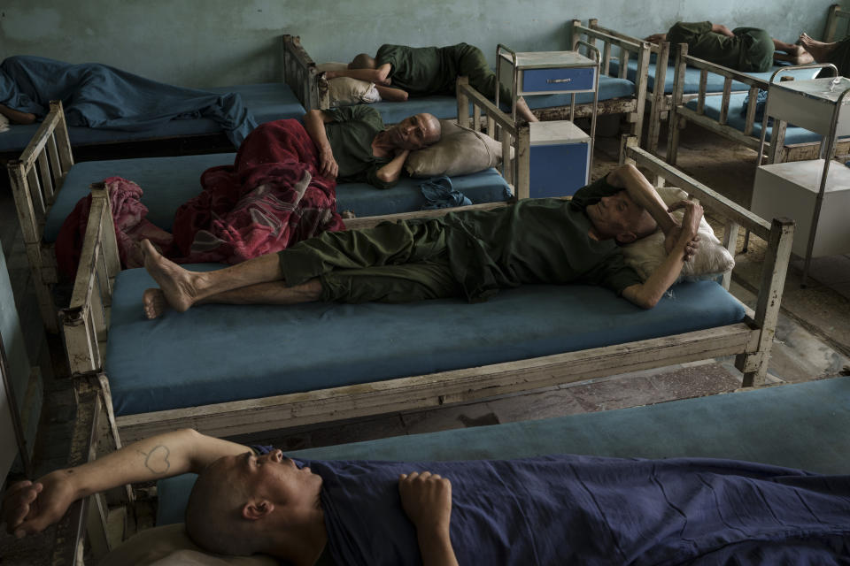 Drug users detained during a Taliban raid rest at the detoxification ward of the Avicenna Medical Hospital for Drug Treatment in Kabul, Afghanistan, Monday, Oct. 4, 2021