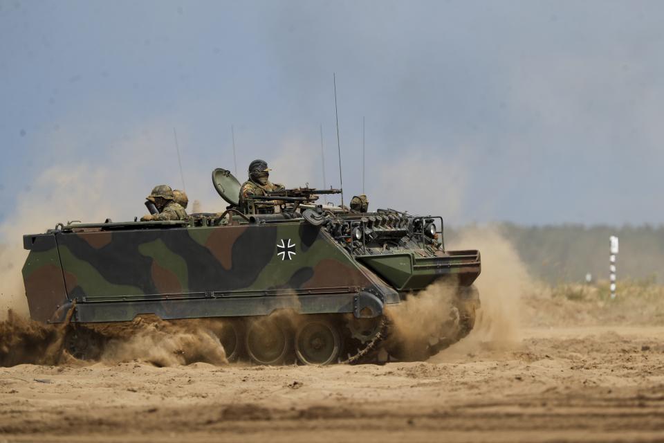 FILE - An armored military vehicle takes part in the Lithuanian-German military exercise 'Griffin Storm 2023' at a training range in Pabrade, some 60km (38 miles) north of the capital Vilnius, Lithuania on Monday, June 26, 2023. The small Baltic countries are among the top contributors of military aid to Ukraine on a per-capita basis. They're also among the staunchest advocates of inviting Ukraine to join NATO, another sensitive issue in the alliance. (AP Photo/Mindaugas Kulbis, File)