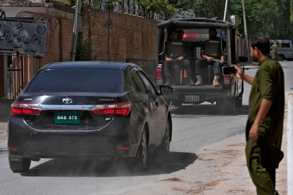 A police squad escort a car carrying a judge of special court leaving after a case hearing of Pakistan’s former prime minister Imran Khan on 30 August (Copyright 2023 The Associated Press. All rights reserved.)