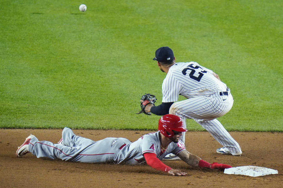 Los Angeles Angels' Andrew Velazquez slides past New York Yankees' Gleyber Torres (25) to steal second base during the eighth inning of a baseball game Tuesday, May 31, 2022, in New York. (AP Photo/Frank Franklin II)