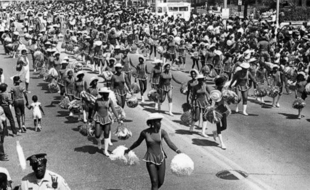 PHOTO: Cheerleaders from a local school walk the parade route during the annual Bud Billiken parade, sponsored by the Chicago Defender, in Chicago, in 1984.  (Robert Abbott Sengstacke/The Abbott Sengstacke Family Papers via Getty Images)