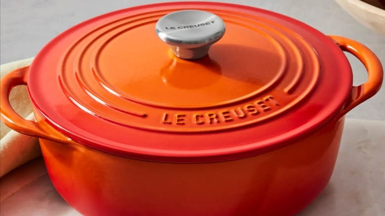 An orange Le Creuset casserole dish