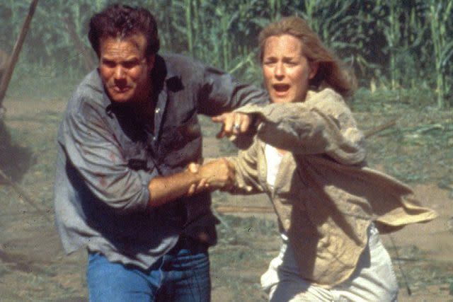 <p>Moviestore/Shutterstock </p> Bill Paxton and Helen Hunt in 'Twister.'