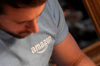 A worker wears a branded T-shirt inside Amazon's Black Friday pop-up space in London, Britain, November 21, 2017. REUTERS/Toby Melville