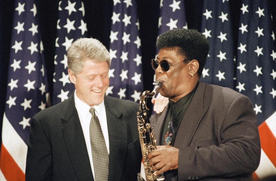 U.S. President Bill Clinton and saxophonist Clarence Clemons on stage in 1993 during a fundraising event at the Fairmont Hotel in San Francisco.