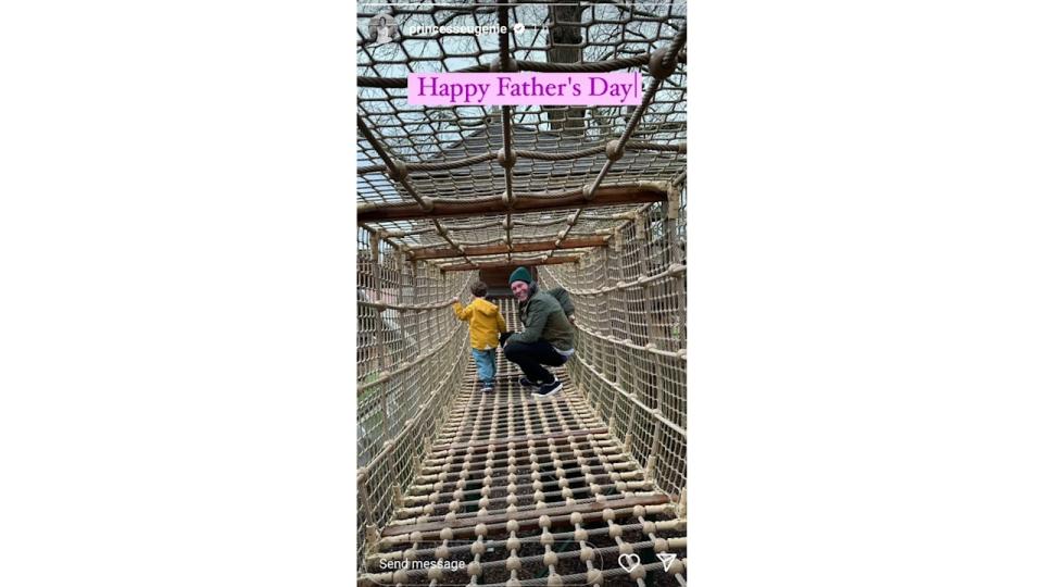 father walking along netted bridge with son