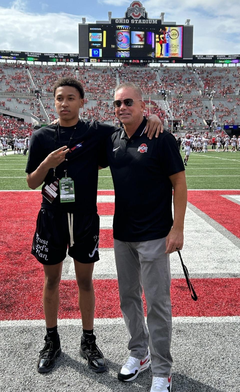 Marcus Johnson, a five-star recruit from Garfield Heights, Ohio, in the class of 2026, poses with Ohio State men's basketball coach Chris Holtmann at Ohio Stadium on Sept. 9, 2023.