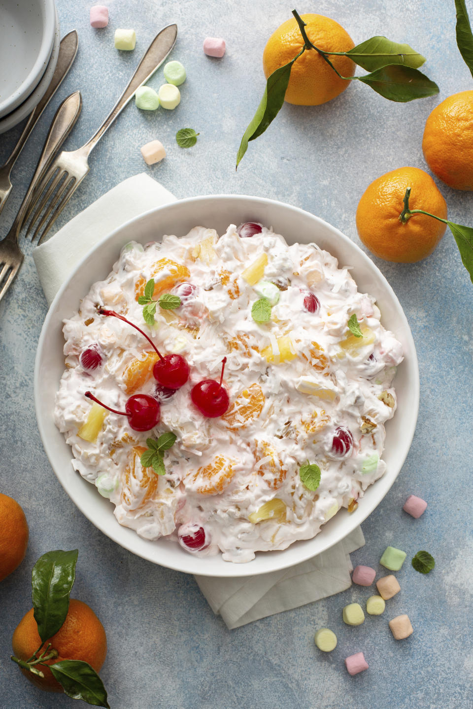 This December 2020 photo shows a recipe for Ambrosia salad for the food blog My Baking Addiction in Suwanee, Ga. The fluffy fruit concoction has a history dating back more than 100 years. (Elena Vaselova for My Baking Addiction via AP).