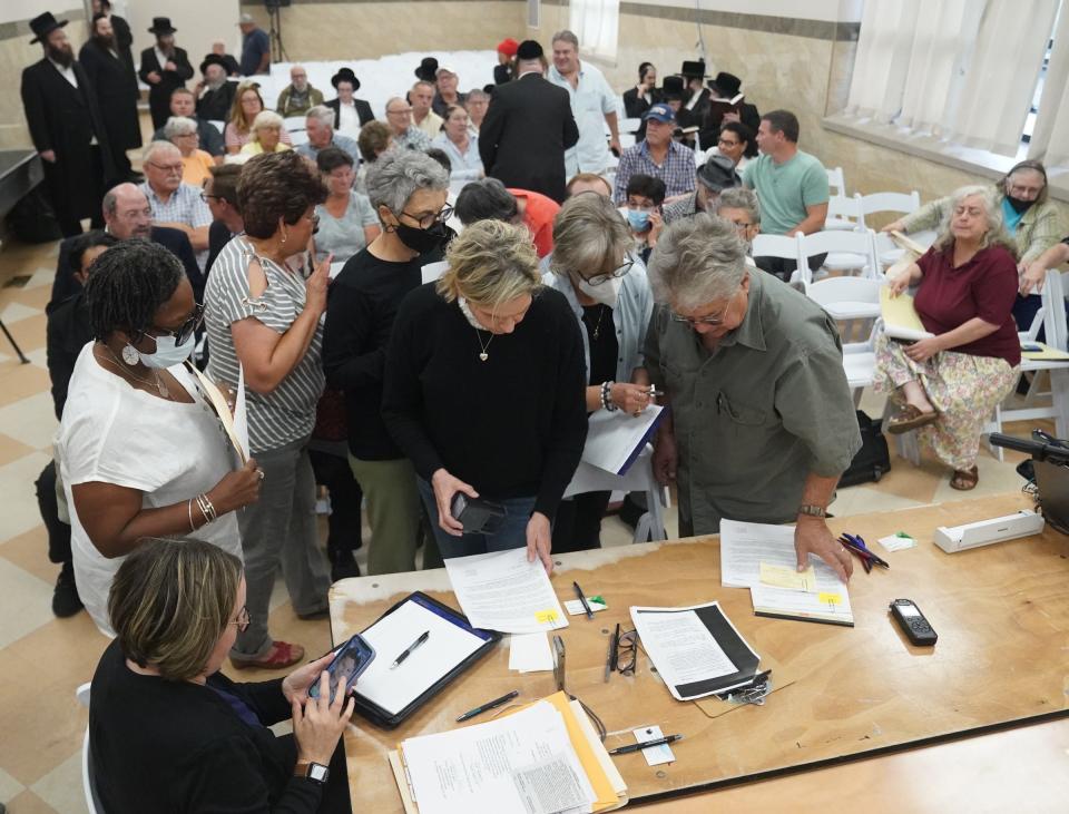 Residents sign up to speak at a public hearing on a petition to create a village within the borders of the towns of Thompson and Fallsburg at Viznitz Institutions synagogue in Kiamesha Lake on Thursday, August 3, 2023.