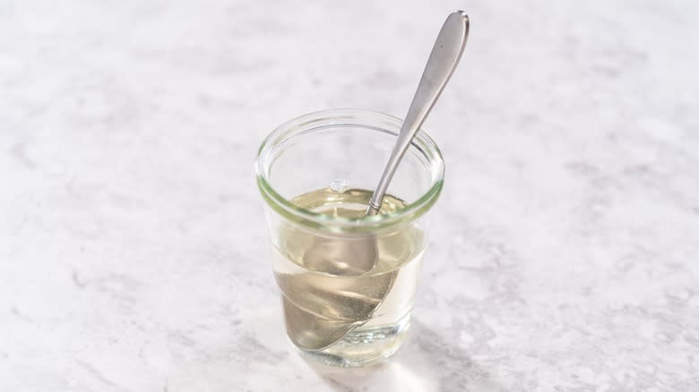 Simple syrup in glass cup