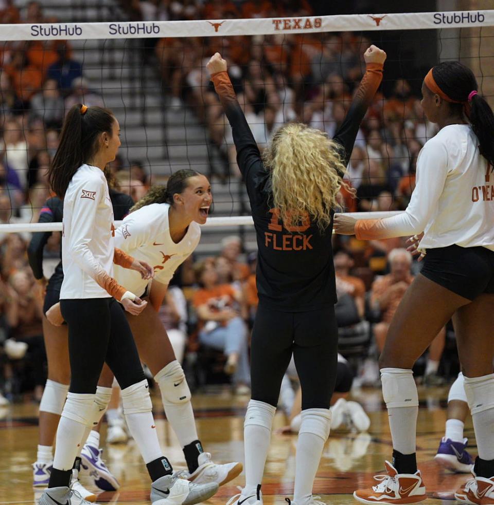 Texas volleyball players cheer after a point during the three-game sweep of TCU on Oct. 5 at Gregory Gym. The No. 1 Longhorns are 14-0 overall and 6-0 in the Big 12 heading into Wednesday's match at Iowa State.