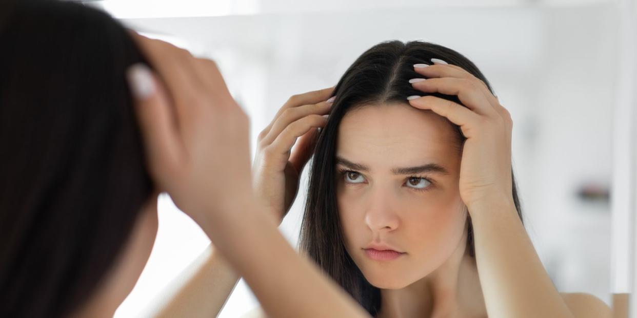 woman having problem with hair loss