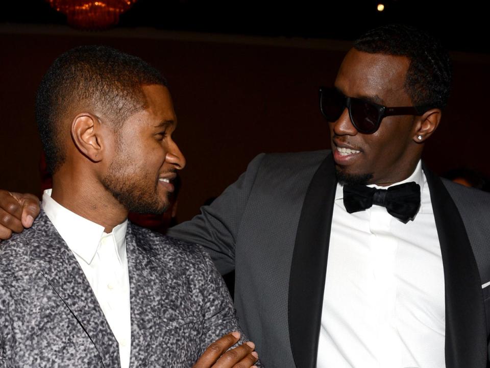 Usher y Diddy en un homenaje a L. A. Reid, en la fiesta previa a los premios Grammy, 2013 (Getty Images para NARAS)