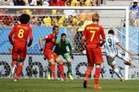 Argentina's Gonzalo Higuain (R) hits a volley to score against Belgium during their 2014 World Cup quarter-finals at the Brasilia national stadium in Brasilia July 5, 2014. REUTERS/Damir Sagolj