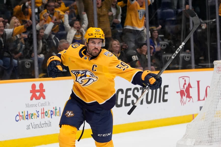 Nashville Predators defenseman Roman Josi (59) celebrates his game winning goal at the end of overtime of an NHL hockey game against the Vegas Golden Knights, Tuesday, March 26, 2024, in Nashville, Tenn. The Predators won 5-4. (AP Photo/George Walker IV)