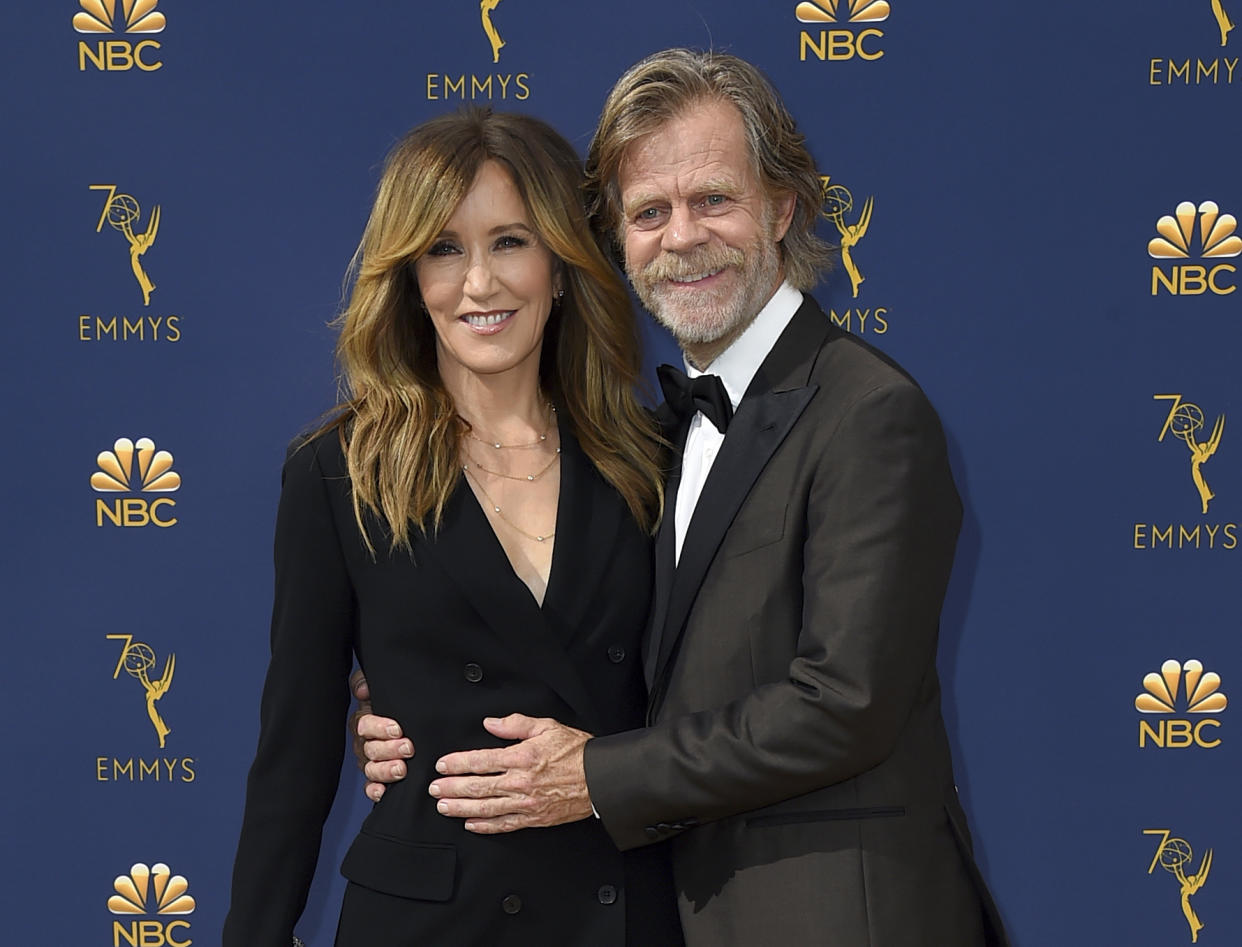 FILE – In this Sept. 17, 2018 file photo, Felicity Huffman, left, and William H. Macy arrive at the 70th Primetime Emmy Awards in Los Angeles. Huffman and Lori Loughlin were charged along with nearly 50 other people Tuesday, March 12, 2019.” (Photo by Jordan Strauss/Invision/AP, File)