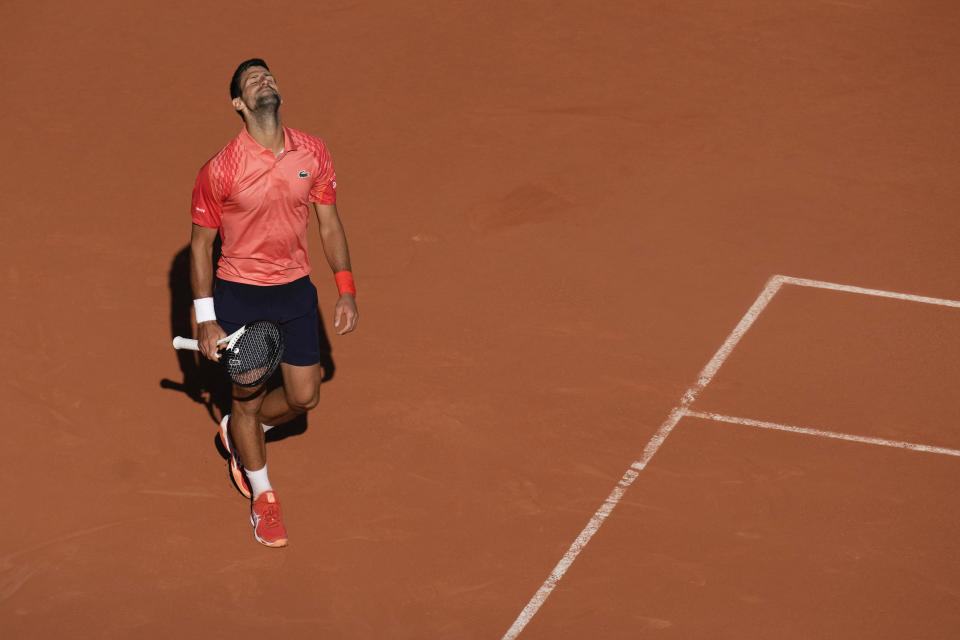 Serbia's Novak Djokovic reacts after missing a shot against Spain's Alejandro Davidovich Fokina during their third round match of the French Open tennis tournament at the Roland Garros stadium in Paris, Friday, June 2, 2023. (AP Photo/Christophe Ena)