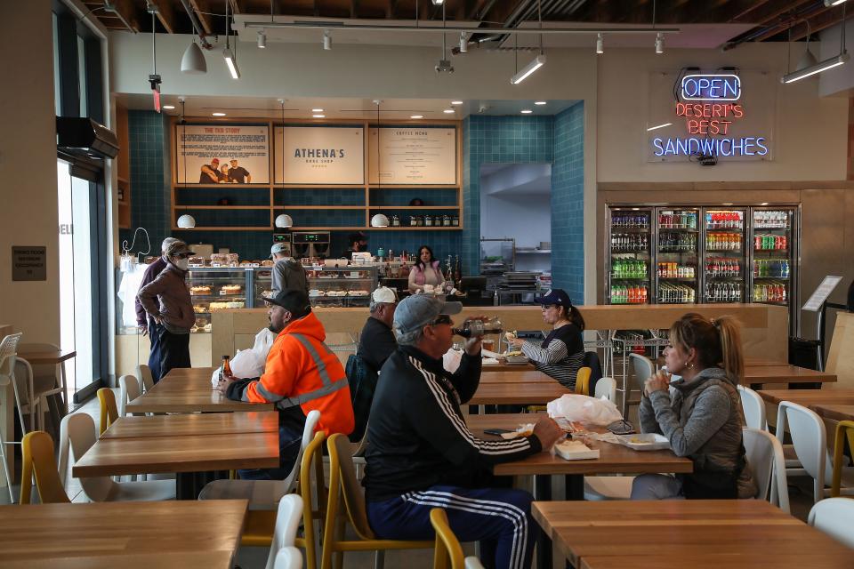 People eat at the newly opened TKB Bakery and Deli in Indio, January 10, 2022.  