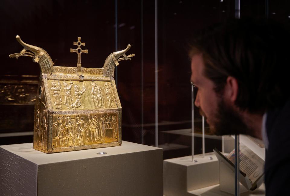 a copper reliquary showing the execution