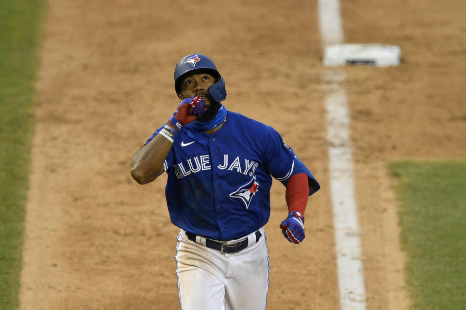 Toronto Blue Jays' Teoscar Hernandez reacts as he heads home on his home run during the eighth inning of a baseball game against the Washington Nationals, Thursday, July 30, 2020, in Washington. The Nationals won 6-4.(AP Photo/Nick Wass)
