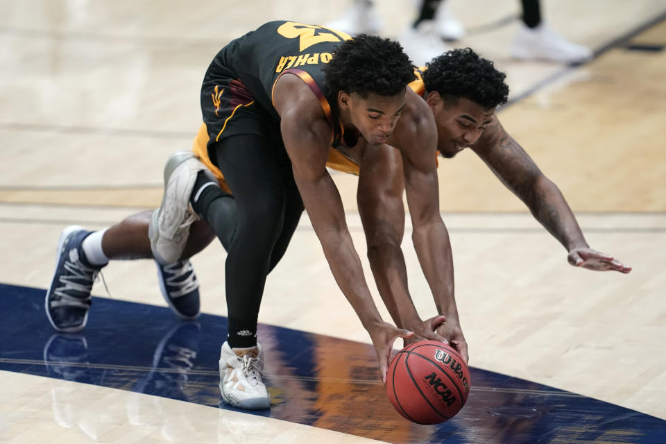 Arizona State guard Josh Christopher, left, reaches for the ball next to California forward Andre Kelly during the first half of an NCAA college basketball game in Berkeley, Calif., Thursday, Dec. 3, 2020. (AP Photo/Jeff Chiu)