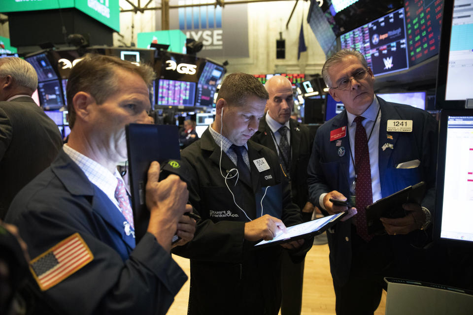 Stock traders work at the New York Stock Exchange, Wednesday, Sept. 18, 2019. The Federal Reserve is expected to announce its benchmark interest rate later in the day. (AP Photo/Mark Lennihan)