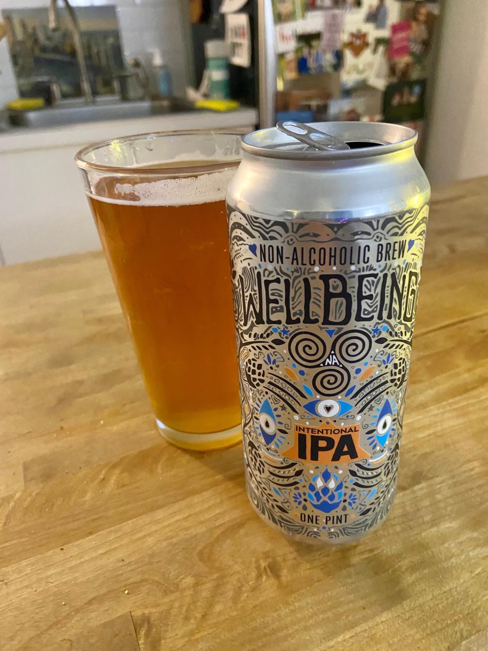 Wellbeing IPA nonalcoholic beer in glass and can