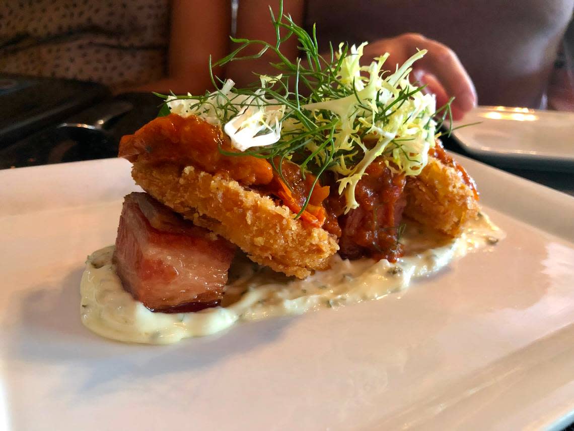 Taylor’s Kitchen makes a fried green tomato appetizer with cubed pork belly.