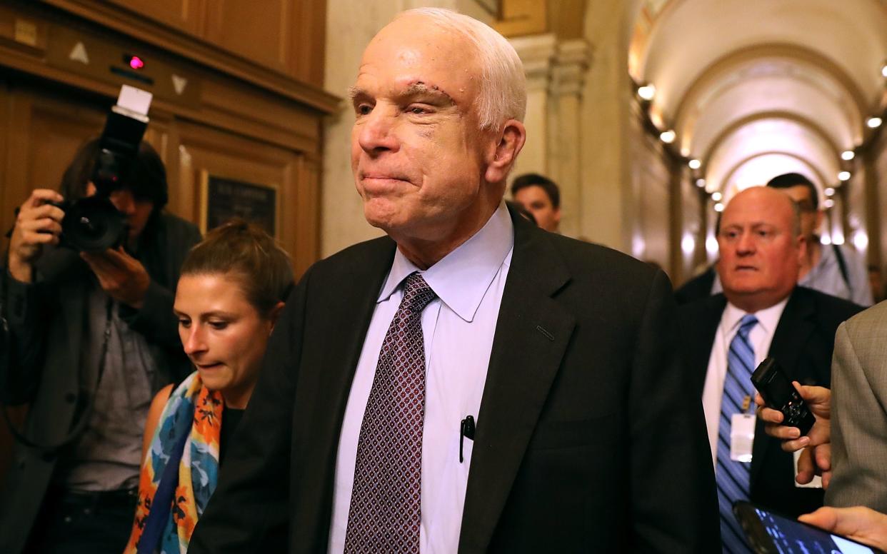 John McCain after voting against the Republican's health care bill in July - 2017 Getty Images